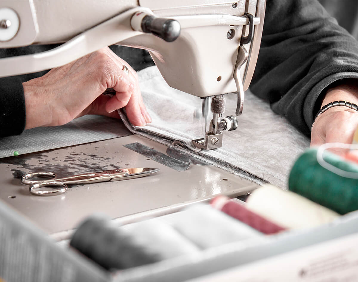 Rettig-Raumausstattung-Naeharbeiten-Naeherei-Bensheim Symbol Blauer Engel